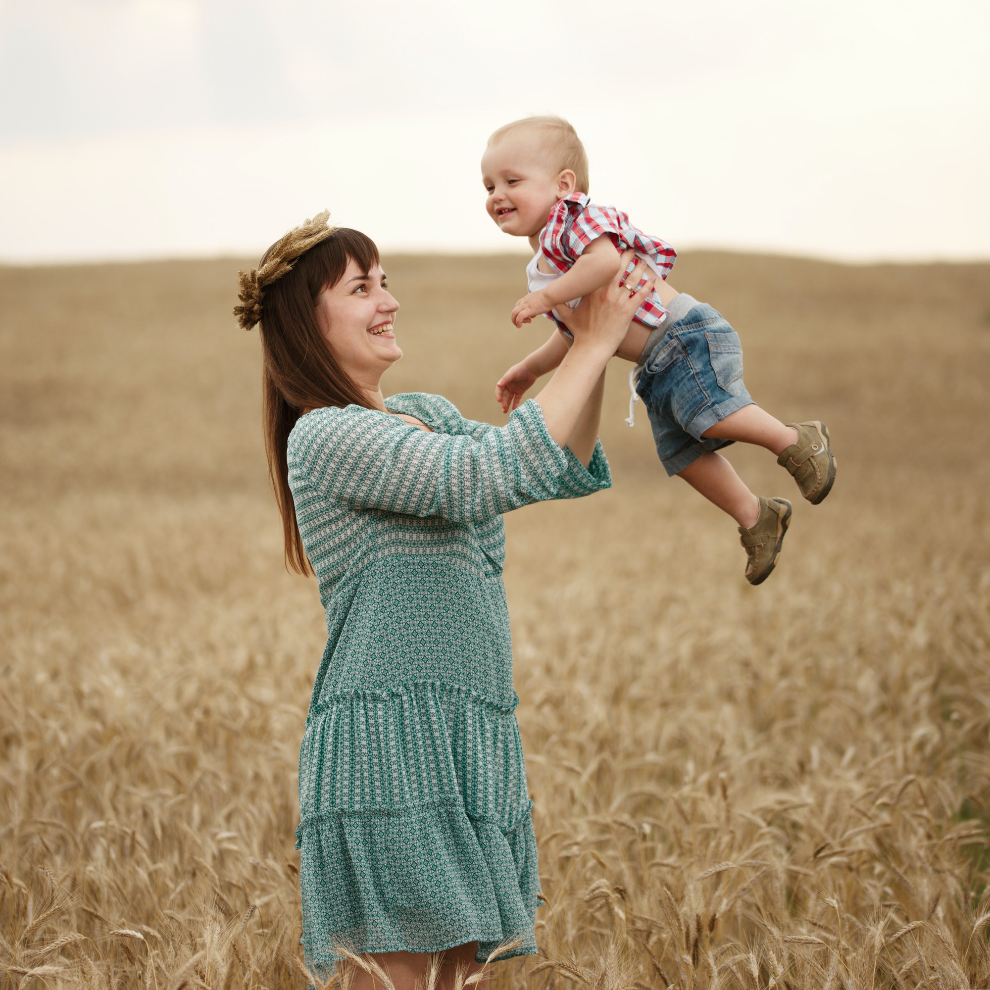 happy mother with son in the field